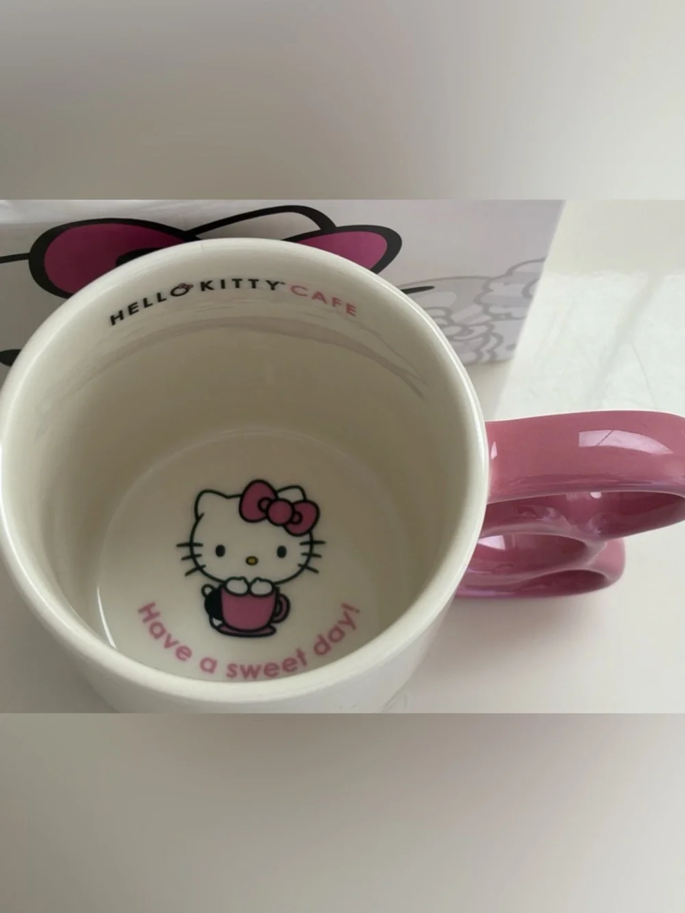 NIB Hello Kitty Cafe White Mug Pink Handle Gray Graphics Logo Box Artwork 12 oz